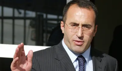 Former Kosovo prime minister Ramush Haradinaj arrives at his home in Pristina, after been released by the U.N. war crimes trial in The Hague until the start of his trial, June 9, 2005. REUTERS/Hazir Reka.
