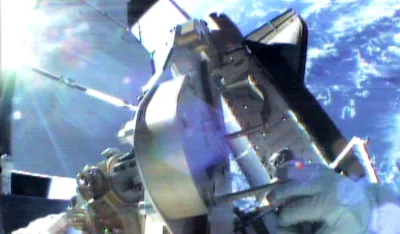 Astronauts left the shuttle Endeavour, pictured below, and made a spacewalk to fix a limp wing on the International Space Station, December 7, 2000. Endeavour's crew installed the solar array on the station on December 3, but one of two wings lined with thousands of photoelectric cells failed to pull taut when it was deployed.    REUTERS/NASA