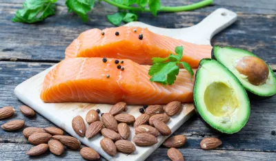 Raw Salmon with Almond and Avocado on a wooden table,healthy food Concept
