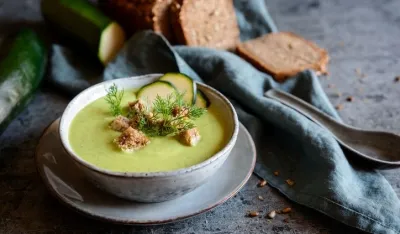 Creamy zucchini soup with croutons in a bowl