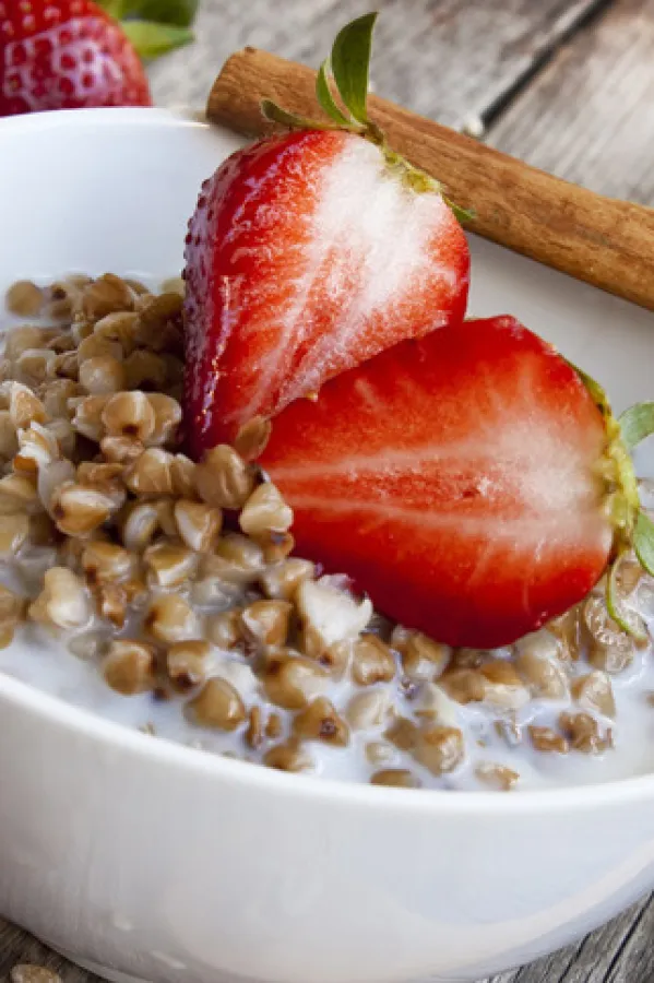 healthy breakfast with fresh strawberries and buckwheat with milk