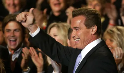 Republican Arnold Schwarzenegger enters a ballroom victory party following his victory in the California gubernatorial recall election in Los Angeles, Tuesday, Oct. 7, 2003. (AP Photo/Stephan Savoia)