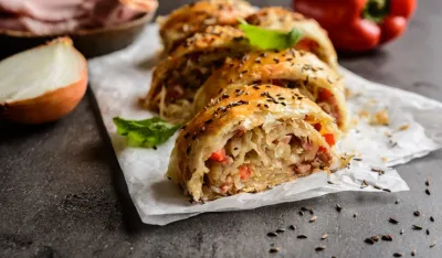 Savory strudel stuffed with sour cabbage, bacon, red pepper and onion