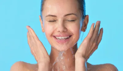 Woman washing her clean face with water. Closeup face of an Young girl washing face with water. Skin care hygiene procedure. 	 <br>