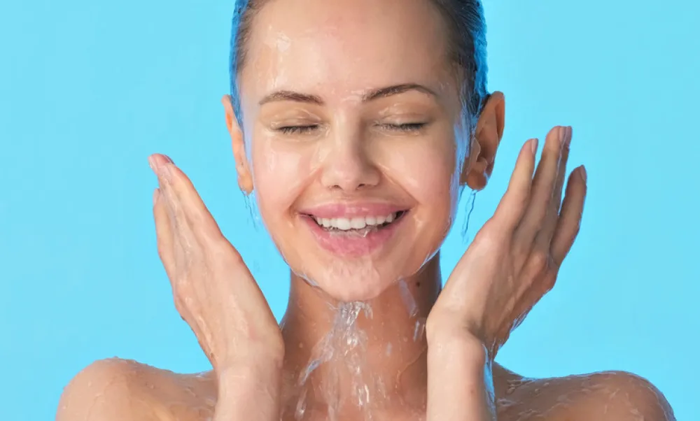 Woman washing her clean face with water. Closeup face of an Young girl washing face with water. Skin care hygiene procedure. 	 <br>