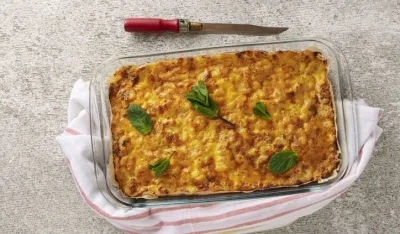 Close-up freshly baked homemade stuffed pie in a baking dish