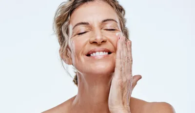 Shot of a mature woman posing with moisturiser on her face