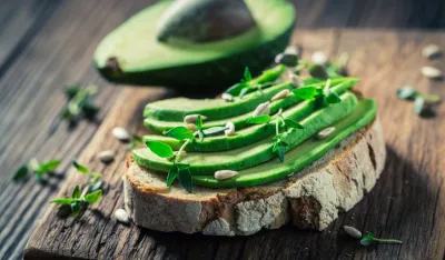 Fresh sandwich with avocado and herbs and seeds