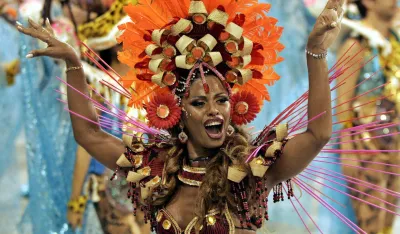 A reveler of the Caprichosos samba school dances at the Sambadrome stadium in Rio de Janeiro February 26, 2006. The Carnival in the beachside city of Rio de Janeiro is famed as one of the world's best parties. REUTERS/Sergio Moraes