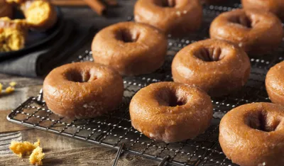 Homemade Glazed Autumn Pumpkin Donuts Ready to Eat