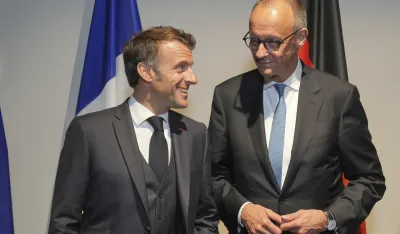 Emanuel Makron i Fridrih Merc