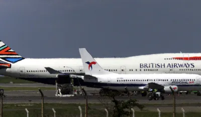 A British Airways Boeing 747-400 jet sits at the Jomo Kenyatta International Airport in Nairobi after a man broke into the cockpit and tried to seize its controls December 29, 2000. The BA2069 flight crew overpowered a 27 year old Kenyan and calmed the plane with 379 passengers before handing him over the Kenyan police. REUTERS/Antony Njuguna