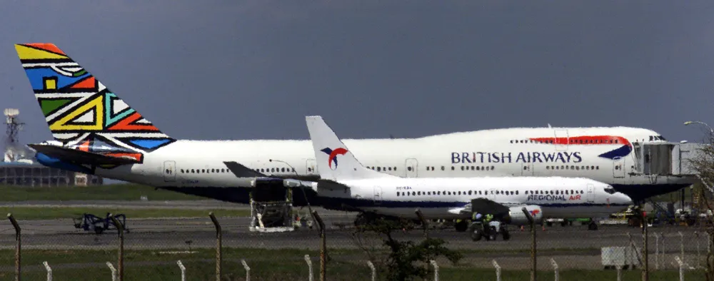 A British Airways Boeing 747-400 jet sits at the Jomo Kenyatta International Airport in Nairobi after a man broke into the cockpit and tried to seize its controls December 29, 2000. The BA2069 flight crew overpowered a 27 year old Kenyan and calmed the plane with 379 passengers before handing him over the Kenyan police. REUTERS/Antony Njuguna